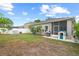Backyard with a covered patio and ample space for Gathering fun, featuring a swing set and playhouse at 298 Clydesdale Cir, Sanford, FL 32773