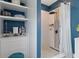 Stylishly renovated bathroom features a tile shower with a rainfall shower head and modern fixtures at 298 Clydesdale Cir, Sanford, FL 32773