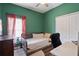 Cozy bedroom with warm colors, a ceiling fan, and a well lit window creates a relaxing space at 298 Clydesdale Cir, Sanford, FL 32773
