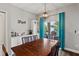 Dining room with modern light fixture, access to patio, and plenty of natural light at 298 Clydesdale Cir, Sanford, FL 32773