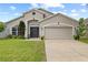 Charming single-story home with a well-maintained lawn and a two-car garage at 298 Clydesdale Cir, Sanford, FL 32773