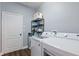 Bright laundry room features modern washer and dryer units, with ample storage space at 298 Clydesdale Cir, Sanford, FL 32773