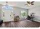 Bright living room with wood floors, large window, and modern furnishings at 298 Clydesdale Cir, Sanford, FL 32773