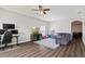 Well-lit living room featuring modern decor, hardwood floors, and a comfortable seating area at 298 Clydesdale Cir, Sanford, FL 32773
