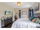 Comfortable main bedroom with dark wood furniture, and plenty of natural light at 298 Clydesdale Cir, Sanford, FL 32773