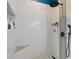 Bright shower with vertically stacked white tiles and black shower fixtures provides a spa-like feel at 298 Clydesdale Cir, Sanford, FL 32773