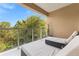 Inviting balcony with comfortable lounge chairs and a peaceful view of a beautiful treeline at 3149 Brasilia Ave, Kissimmee, FL 34747
