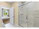 View from bathroom to bedroom with sliding glass shower door at 3149 Brasilia Ave, Kissimmee, FL 34747
