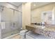 Granite countertop and a glass-enclosed shower, creating a functional and stylish space at 3149 Brasilia Ave, Kissimmee, FL 34747