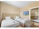 This bedroom features two beds, upholstered headboards, and a television for relaxing entertainment at 3149 Brasilia Ave, Kissimmee, FL 34747