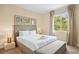 Comfortable bedroom with a plush bed, neutral decor, bright window and natural light at 3149 Brasilia Ave, Kissimmee, FL 34747
