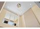 High ceiling view of the modern chandelier and the architecture of the home at 3149 Brasilia Ave, Kissimmee, FL 34747