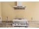 Outdoor kitchen area with stainless steel grill, sink and granite countertops at 3149 Brasilia Ave, Kissimmee, FL 34747