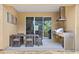 Covered outdoor patio with a dining table, built-in grill, sink, and granite countertop at 3149 Brasilia Ave, Kissimmee, FL 34747