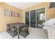 Covered patio featuring a dining table and outdoor kitchen with a grill and sink at 3149 Brasilia Ave, Kissimmee, FL 34747