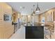 Stylish kitchen features a spacious island, stainless steel appliances, and contemporary finishes at 3149 Brasilia Ave, Kissimmee, FL 34747