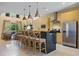 Bright kitchen features a large island with bar seating, stainless steel appliances, and an open layout at 3149 Brasilia Ave, Kissimmee, FL 34747