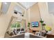Bright and open living room featuring a tall window, comfortable seating, and modern decor at 3149 Brasilia Ave, Kissimmee, FL 34747