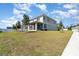 Spacious backyard with a screened porch, well-maintained lawn and mature trees at 31792 Broadwater Ave, Leesburg, FL 34748
