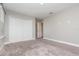 Bedroom featuring neutral walls, carpet, and a closet at 31792 Broadwater Ave, Leesburg, FL 34748