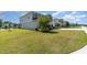 Two-story home featuring a large yard, two-car garage, and neutral paint scheme at 31792 Broadwater Ave, Leesburg, FL 34748