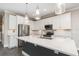 Bright, modern kitchen featuring stainless steel appliances, quartz countertops and large central island at 31792 Broadwater Ave, Leesburg, FL 34748