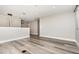 Contemporary living area with sleek flooring, neutral walls and modern lighting fixtures at 31792 Broadwater Ave, Leesburg, FL 34748