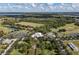 An aerial view showcases a well-planned community with a golf course, lakes, and abundant green space at 3349 Sagebrush St, Harmony, FL 34773