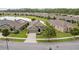 An aerial front view of the lovely home, showcasing its well-maintained lawn and appealing design at 3349 Sagebrush St, Harmony, FL 34773