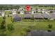 Aerial view of a beautiful property with a well-maintained yard and a serene lake view at 3349 Sagebrush St, Harmony, FL 34773