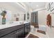 Bathroom featuring double sinks, tile floor, and shower-tub combination at 3349 Sagebrush St, Harmony, FL 34773