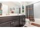 Bathroom featuring double sinks, a full tub, and neutral color scheme at 3349 Sagebrush St, Harmony, FL 34773