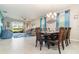 Bright dining area features dining table and access to the living room and outdoor patio at 3349 Sagebrush St, Harmony, FL 34773