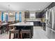 Open kitchen with granite counters, stainless steel appliances, and a large island with seating at 3349 Sagebrush St, Harmony, FL 34773
