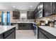 Well-equipped kitchen featuring sleek countertops, stainless appliances, and generous cabinet storage at 3349 Sagebrush St, Harmony, FL 34773