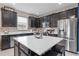 Modern kitchen with granite countertops, stainless steel appliances, and ample cabinet space at 3349 Sagebrush St, Harmony, FL 34773
