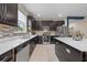 Contemporary kitchen with stainless steel appliances, quartz countertops, and modern tile backsplash at 3349 Sagebrush St, Harmony, FL 34773