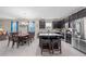 Spacious kitchen with dark cabinetry, stainless steel appliances, and an island with seating at 3349 Sagebrush St, Harmony, FL 34773