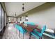 This screened in lanai offers an outdoor dining area with views of the lush backyard at 3349 Sagebrush St, Harmony, FL 34773