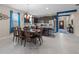 Open-concept kitchen, dining, and entry area with modern finishes and abundant natural light at 3349 Sagebrush St, Harmony, FL 34773