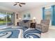 Cozy living room featuring neutral furnishings, a ceiling fan, and a sliding glass door at 3349 Sagebrush St, Harmony, FL 34773