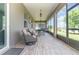 Extended screened-in patio overlooking the beautiful backyard with plenty of seating at 3349 Sagebrush St, Harmony, FL 34773