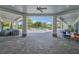 Clubhouse pool area with pool, outdoor furniture and landscaped palms at 3349 Sagebrush St, Harmony, FL 34773