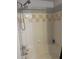 Bathroom featuring a shower and bathtub combination with tiled walls at 3417 Westchester Square Blvd # 202, Orlando, FL 32835