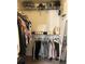 Walk-in closet with shelving and hanging racks for organized clothing storage at 3417 Westchester Square Blvd # 202, Orlando, FL 32835