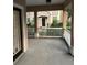 Covered porch featuring a view of a neighboring townhome at 3417 Westchester Square Blvd # 202, Orlando, FL 32835