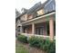 Inviting two-story townhome with a cozy front porch and manicured landscaping at 3417 Westchester Square Blvd # 202, Orlando, FL 32835