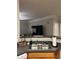 Kitchen sink area featuring stainless steel sink, countertop, and decor, open to living area at 3417 Westchester Square Blvd # 202, Orlando, FL 32835