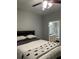 Inviting main bedroom with ceiling fan and ensuite bathroom access at 3417 Westchester Square Blvd # 202, Orlando, FL 32835