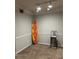 Cozy room displaying unique decor with a surfboard art piece at 3417 Westchester Square Blvd # 202, Orlando, FL 32835